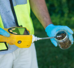 Geologist,worker,taking,measurements,of,soil,probe,by,scientific,equipment